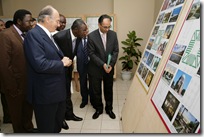 Farrokh Derakshani, Director of the Aga Khan Award, with His Highness the Aga Khan and representatives of the Ministry of Culture looking at exhibition panels on the work of the AKAA.