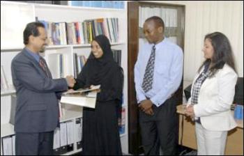 Coastweek - - The Regional CEO, Arif Neky (left) congratulates Aisha Omar Mohammed on her receipt of the Aga Khan Foundation International Scholarship Programme (ISP) award, while, Peter Mawioo, also an ISP award recipient (centre) and AKF Kenya Executive Officer Nasrin Shamji-Dewany look on.