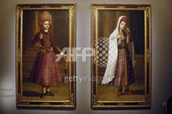 Two paintings featuring young stylish people (Iran, end of the 18th century) are presented in the exhibition The Song of the World, 02 October 2007 at the Musee du Louvre in Paris. The exhibition, which takes place from 05 October until 07 January 2008, outlines the evolution of art in Iran under the Safavid Dynasty (1501?1736) presenting a selection of masterpieces from the Aga Khan collection of Islamic art, as a preview to the opening of the Aga Khan Museum in Toronto. AFP PHOTO STEPHANE DE SAKUTIN