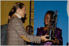 Anna Tibaijuka, Executive Director of UN Habitat, giving the World Habitat Day Award to Princess Zahra Aga Khan.