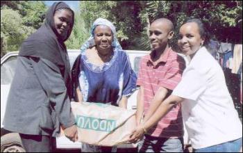 Coastweek - - FOOD FOR CHILDREN. Fauzia Hassan (second left), the Director of Mama Fauzia Children's Home, Kasarani, received bags a maize flour from Ida Majid (left) Paul Njihia (second right) and Nancy Maina (right), members of staff of the Aga Khan University Hospital. The Aga Khan Development Network donated food, clothes and cooking oil to the children`s home which houses 51 youngsters most of whom were abandoned by their parents.