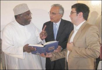  Dr Nader El-Bizri and Professor Azim Nanji explaining to Professor Rashid some of the refe- rences in the book