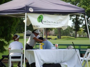 Golfers are treated to a nice massage on the course to relax as the heat in Houston gets up to 100 degrees.