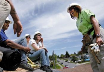 Nillofur Jasani, right, program director for One Nation...at Habitat for Humanity’s first interfaith build in Pierce County