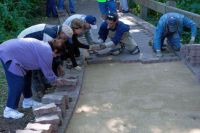 Ismaili Volunteers help repave Naperville Riverwalk