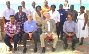 Coastweek-- Seated [from left] Dr. Amyn Lakhani, Prof. Duncan Saunders, Dr. John Tomaro, Arif Alibhai. Standing Kidde Abel, Celestina Nyenga, Mohamed Mwaita, Christopher Ziro, Lucy Nyaga, Dr. Badru A. Muhaji, Esther Nderitu, Felix Agoi, Zuhura Kissua, Joshua Ongwae, Mercy Ndemo.