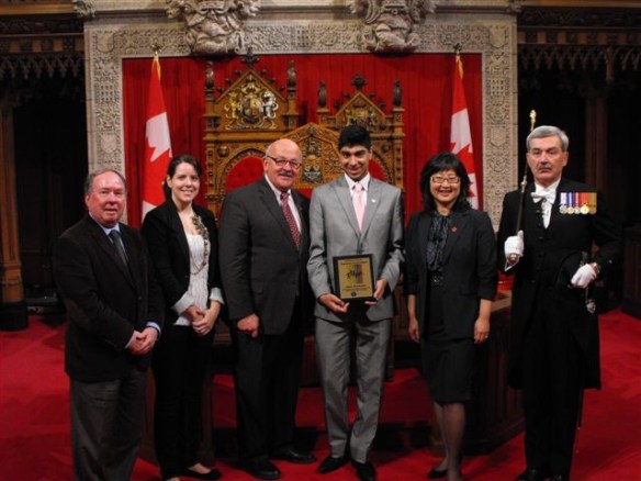Adam Keshavjee presented with the "Awesome Youth" award in Senate in recognition of National Child Day Senator Jim Munson, Mandi Duhamel - CAYFO, Sen. Terry Mercer, Adam Keshavjee, Sen. Yonah Martin and Mr. Kevin MacLeod - Usher of the Black Rod
