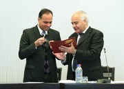 Dr. Ilolov, President of the Academy of Sciences of the Republic of Tajikistan, presents Professor Kassam with the Certificate of Membership (Academician) to the Academy of Sciences