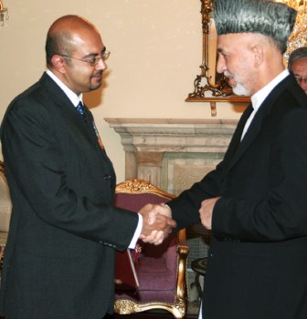 Canada's Ambassador to Afghanistan, Arif Lalani being greeted by Afghanistan's President Hamid Karzai