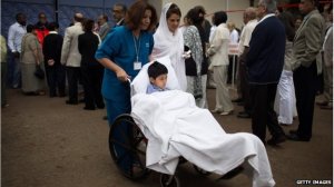 Alyaz Merali, wounded in the attack, took part in a funeral procession for his mother, who was killed