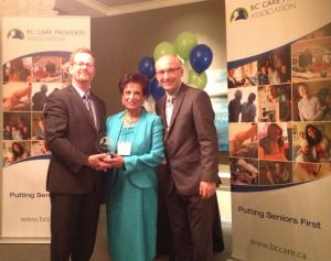 Nurjehan Devji presented award by B.C. Health Minister Terry Lake