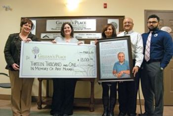 As a tribute to their son who died last year in a car accident, the Merani family has raised $13,000 for Gillian’s Place and is also organizing a mountain trek in northern Africa. From left are Anne Armstrong and Nicole Regehr from Gillian’s Place, Nazlin and Moe Merani, and their son Aleem.