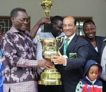 Hon. Prime Minister of Tanzania and Altaf Hirani, holding the Street Child World Cup 2014 Trophy Hirani's soccer team won at the competetion held in Rio just before the FIFA World Cup.