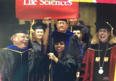 Jenifer Tharani holding college flag