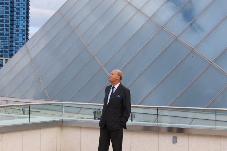 Prince Amyn admiring the view of Aga Khan Museum from the terrace of the Ismaili Centre, Toronto (crystalline rooftop of the Ismaili Centre in the background). Prince Hussain taking pictures from the Ismaili Centre, Toronto terrace. [Image © Ismailimail/AM]