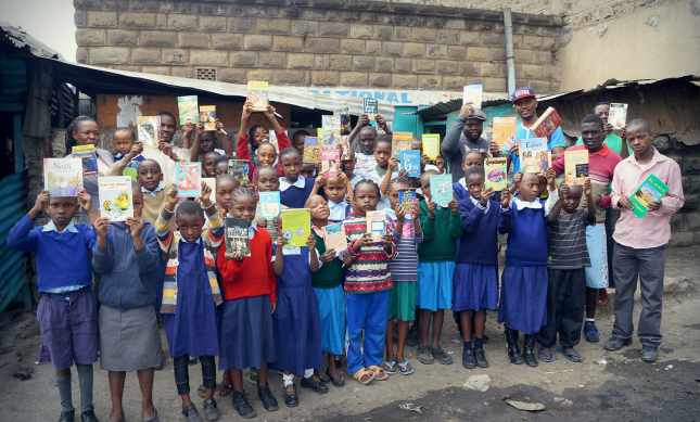 Children at Viara Junior Academy receive books as rewards for their commitment to learning. (Courtesy of Bamba)