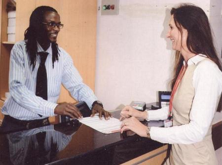 Dr Linda Thorpe [right] the Head of Family Medicine Centre (FCM) at the Aga Khan University Hospital, discusses patient bookings with Laurence Kinyanjui, the Unit Coordinator at the new, modern and patient friendly facility. (image via Coastweek)