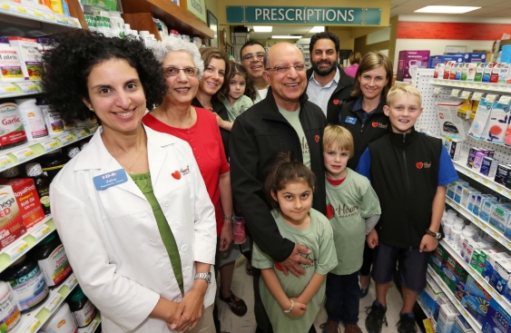 Running the newly renamed Heart pharmacies is a family business for the Rayanis, including, from left, Zahra Rayani-Kanji, Yasmine Rayani, Laurel Rayani, Naeema Rayani, 4, Farhan Kanji, founder Naz Rayani, Anigg Rayani, 7, Rasool Rayani, Rhys Watson, 8, Adele Fraser and Miles Watson, 10. (Photograph By ADRIAN LAM, Times Colonist)