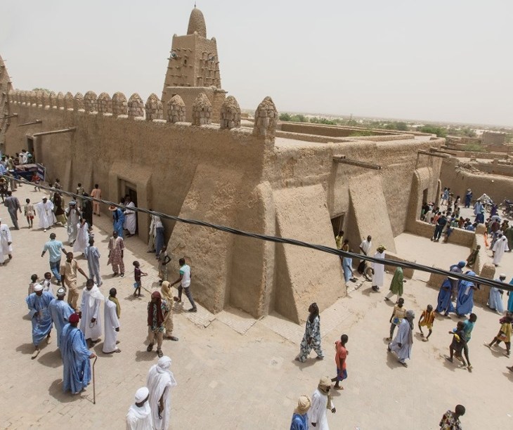 The Djinguereber mosque at the end of Friday midday prayers. Photograph Sean Smith via The Guardian