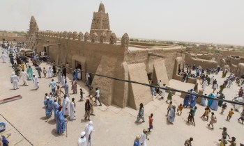 The Djinguereber mosque at the end of Friday midday prayers. Photograph Sean Smith via The Guardian