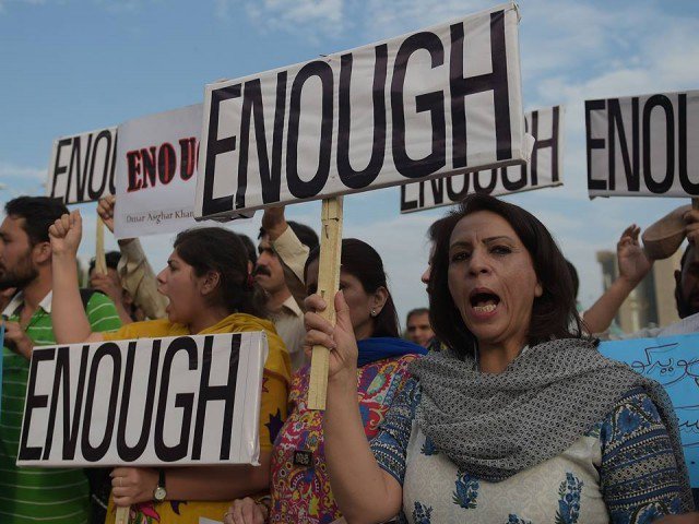 Enough is Enough - Pakistani civil society activists carry placards as they shout slogans during a protest against the killing of Ismailis (Photo: AFP via newagebd.net)