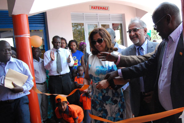 Dr Hajee Safir (2nd R) one of the funders of the Child Development Centre and Mr James Baba (R), the State Minister for Internal Affairs, open the centre in Koboko District. (image credit: Clement Aluma / Sunday Monitor - Uganda)