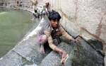 Workers carry out conservation work at Hazrat Nizamuddin Auliyas baoli in New Delhi. (Photograph: Anindito Mukherjee/EPA via The Guardian)