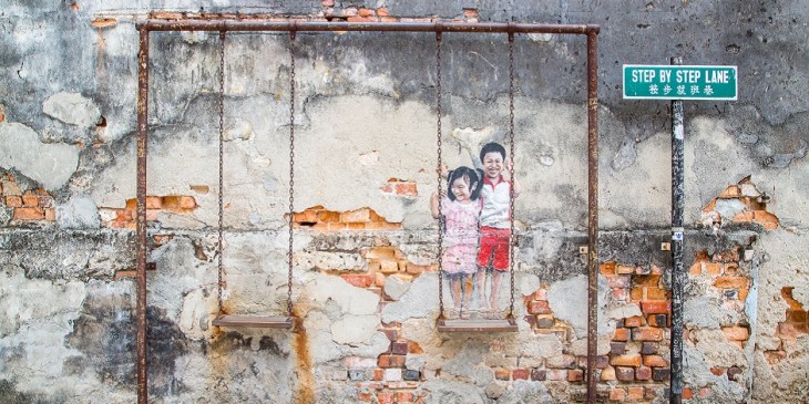 Realistic Children on the Swing at Step by Step Lane in George Town Malaysia. The Aga Khan Trust is once again working with the state government and Think City Sdn Bhd to provide technical assistance in restoration and preservation of the heritage site. (Image via The Rakyat Post)