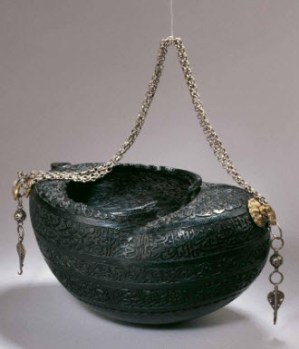 Beggar’s bowl (kashkul), dated 18th century Iran, carried by a Sufi dervish as a sign of renouncing all worldly possessions. The upper band of inscription contains the Nad-e ‘Ali, the devotional prayer to ‘Ali. (Image: Aga Khan Museum)