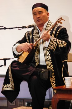 Kazakh musician Almasbek Almatov plays the dombra. (Photograph: Linda Vartoogian/Getty Images via The Guardian)