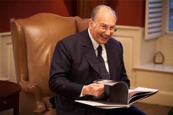 The Aga Khan meets with Harvard President Drew Faust in her Massachusetts Hall office at Harvard University. The Aga Khan is pictured looking at a photo book during his visit. Stephanie Mitchell/Harvard Staff Photographer