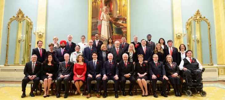 The swearing-in ceremony of the new Prime Minister, the Right Honourable Justin Trudeau, seated 5th from left, and his cabinet took place at Rideau Hall on Wednesday November 4, 2015. The ceremony was presided by the Governor General of Canada, the Right Honourable David Johnston, who is is shown in the photo on the right of the Prime Minister. (Image credit: Sgt. Ronald Duchesne, Rideau Hall)