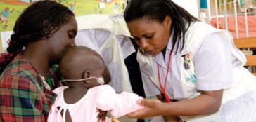 A nurse in Kampala, Uganda, examines a young patient. The Advanced Nursing Studies programme in Kenya, Tanzania and Uganda has been graduating diploma and BScN degree nurses since 2002. Developed at the request of nursing leaders and the respective governments, the programme offers continuing and higher education to working nurses, allowing them to remain at their workplaces while pursuing professional development. Photo: AKDN/Jean-Luc Ray