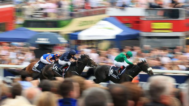 Aga Khan's Harzand, (right) ridden by Pat Smullen on the way to winning The Investec Derby during Derby Day - (image credit: Liverpool Echo)