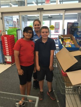 Nurain and Zachary with Kim, manager of Staples at Cloverdole