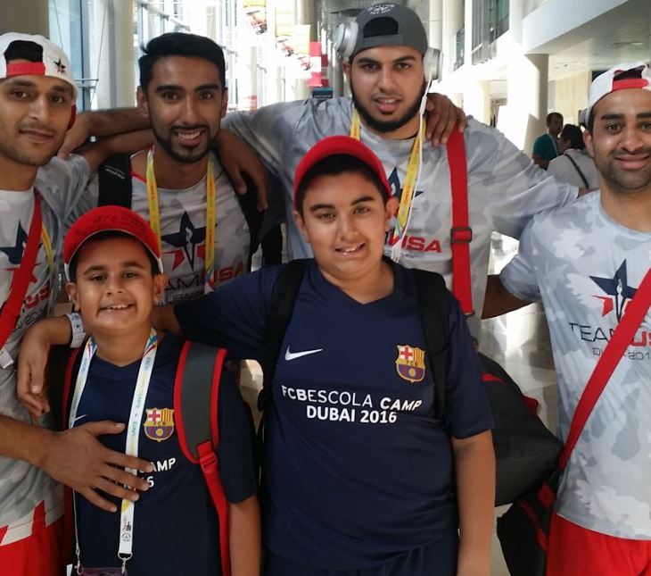 Riyaan (front left) is seen pictured with his older brother Qayl after Team USA Blue players (l to r) Adnan Dahlvani, Zohib Hadi, Naushad Lalani and Irfan Charania autographed his cap. (Image Credit ASJM)