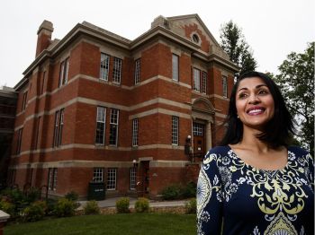 Salima Ebrahim poses at the Strathcona branch of the Edmonton Public Library in Edmonton (Codie McLachlan/Postmedia)