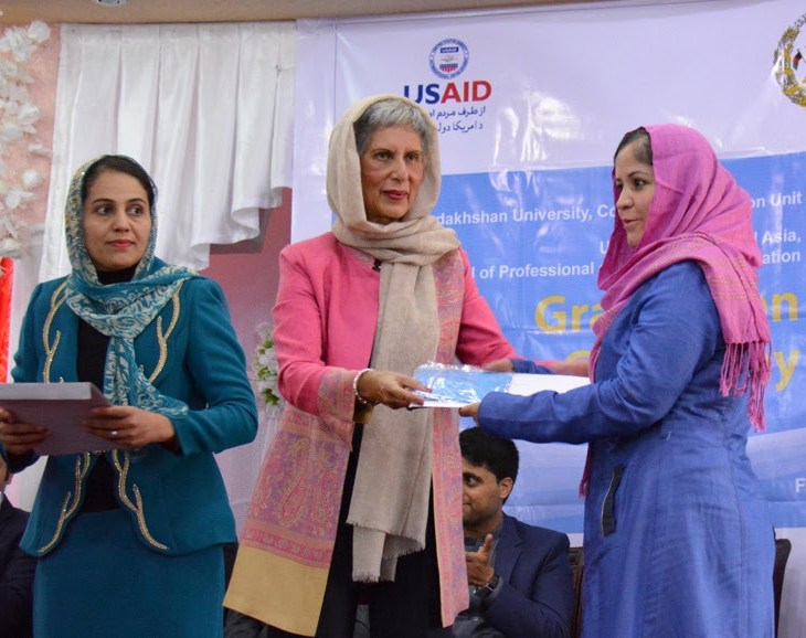 English Upper-Intermediate Graduate Nasima Puya Habibi (right) receives certificate from Mrs Nurjehan Mawani (left), Aga Khan Development Network Diplomatic Representative.