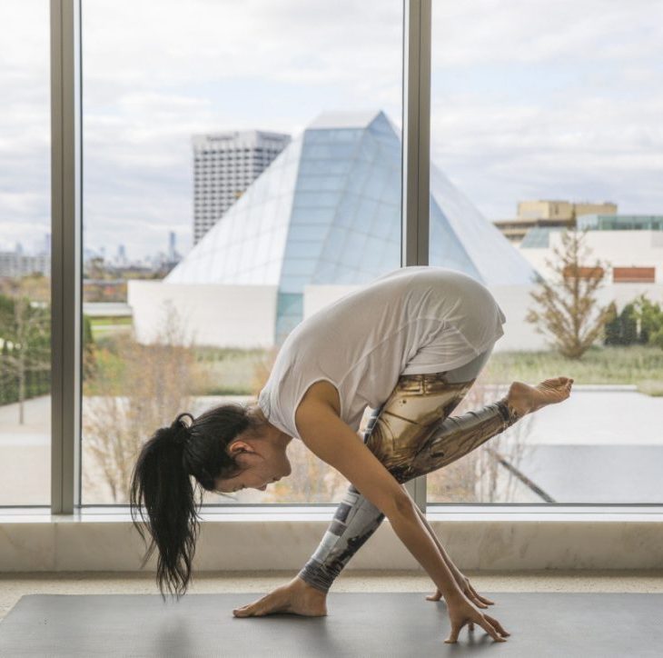 Yoga instructor YuMee Chung demonstrates a daring Pyramid Pose at the Aga Khan Museum, with the Ismaili Centre, Toronto in the background. (Image credit: Anne-Marie Jackson)