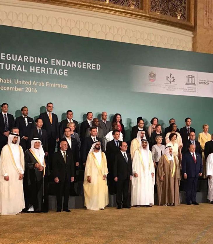 ABU DHABI, UNITED ARAB EMIRATES – December 03, 2016: (front row L-R) HH Prince Karim Aga Khan IV, HH Sheikh Jassim bin Hamad Al Thani Personal Representative of the Emir Qatar, HRH Prince Khalid al Faisal Advisor to the Custodian of the Two Holy Mosques and Governor of Makkah Region, HE Ashraf Ghani President of the Islamic Republic of Afghanistan, HH Sheikh Mohamed bin Rashid Al Maktoum, Vice-President, Prime Minister of the UAE, Ruler of Dubai and Minister of Defence, HE Francois Hollande, President of France, HH Sheikh Mohamed bin Zayed Al Nahyan, Crown Prince of Abu Dhabi and Deputy Supreme Commander of the UAE Armed Forces, HH Sheikh Sabah Al Ahmad Al Jaber Al Sabah Emir of Kuwait, HE Abdrabbuh Mansour, Hadi President of Yemen, HE Ibrahim Boubacar Keita, President of Mali, HE Hailemariam Desalegn Prime Minister of Ethiopia, HH Sheikh Nasser bin Hamad bin Isa Al Khalifa, HE Yusuf bin Alawi bin Abdullah Foreign Minister of Oman (R), (2nd row) HE Alexis Tsipras, Prime Minister of Greece (3rd L), HE Denis Zvizdic, Chairman of the Council of Ministers of Bosnia and Herzegovina (4th L), HE Jack Lang President of Institut du Monde Arabe (5th L), HE Mohamed Khalifa Al Mubarak Chairman of Abu Dhabi Tourism & Culture Authority (6th L), HE Irina Bokova Director General of UNESCO (7th L) and other dignitaries from over 40 countries, stand for a photograph during the Safeguarding Endangered Cultural Heritage Conference at Emirates Palace. (Image via Ismaili.net)