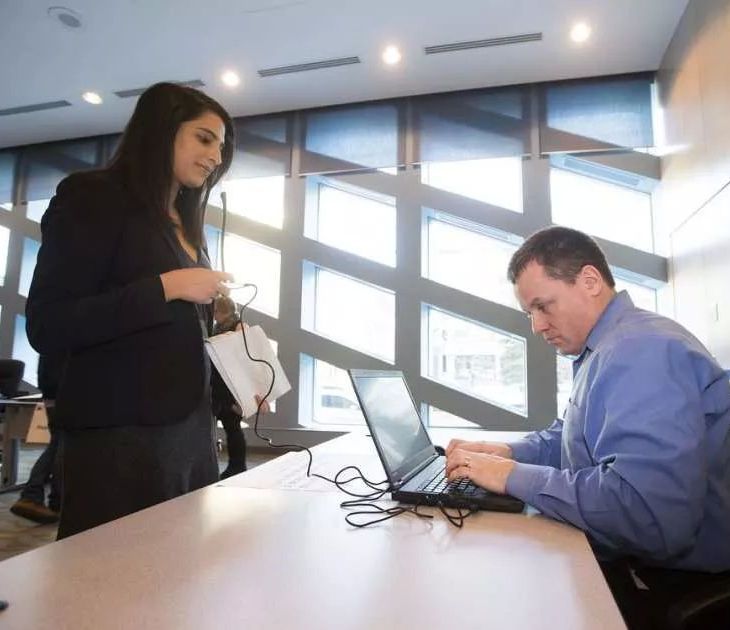 Danisha Bhaloo, recording her name for City of Edmonton employee Robert Gagnon on Jan. 25, 2016, was recognized as a Star of Alberta for her work as an advocate for vulnerable youth, during a ceremony Monday at Government House. GREG SOUTHAM / POSTMEDIA, EDMONTON JOURNAL