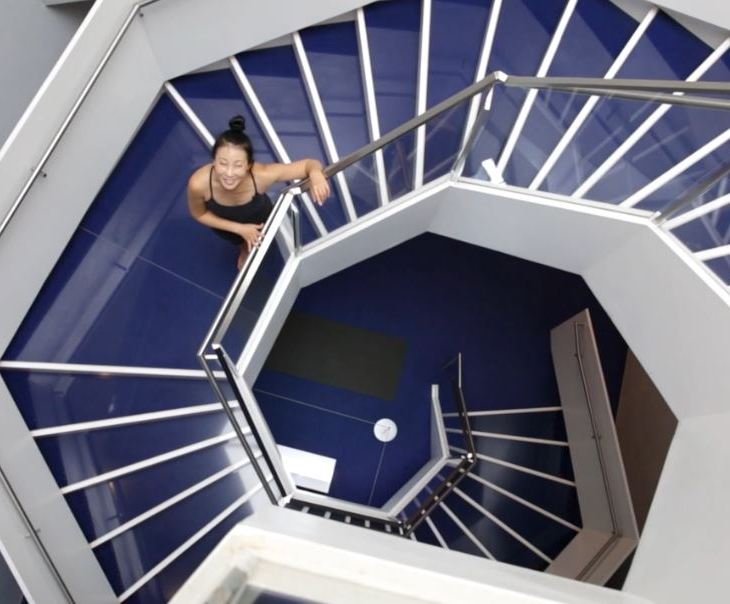 Yoga instructor YuMee Chung ready to demonstrate the 'Upward Spiral' yoga pose inspired by the twirling hexagonal staircase at the Aga Khan Museum. (Image credit: Anne-Marie Jackson via Toronto Star)