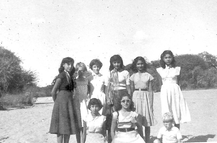 My sister (second from left) and me (bottom right) are pictured on a picnic with some of the girls from the school. We were dropped off from a lorry in a remote dry river bed for the picnic. Unfortunately the lorry did not return when arranged and after it got dark we lit fires to keep away the hyenas while we waited till we were eventually picked up.