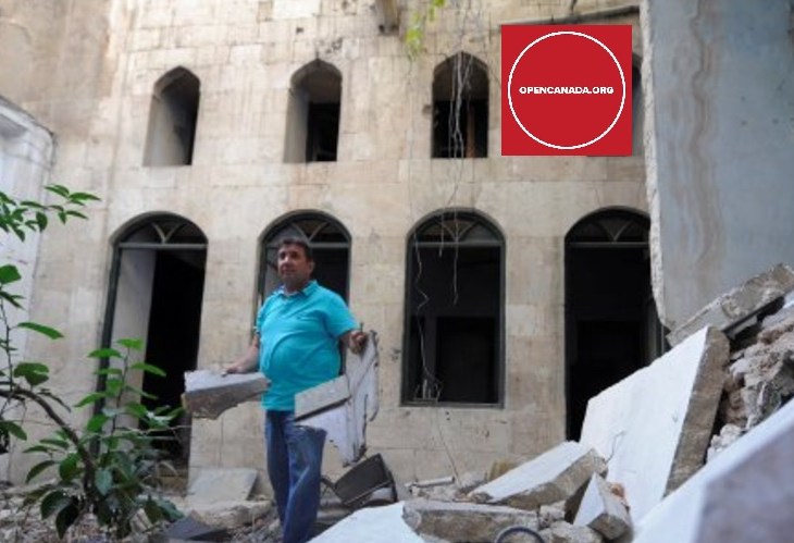 Mustafa al-Now is seen on debris in the old city of Aleppo, Syria July 16, 2017. (Image credit: REUTERS/Omar Sanadiki via Open Canada)