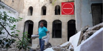 Mustafa al-Now is seen on debris in the old city of Aleppo, Syria July 16, 2017. (Image credit: REUTERS/Omar Sanadiki via Open Canada)