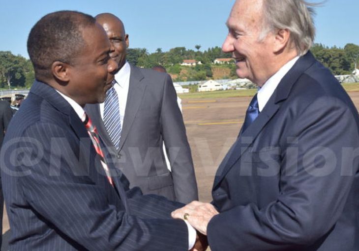 Attorney General William Byaruhanga receives the Aga Khan at Entebbe Airport yesterday evening. (Credit: William Rujuta)