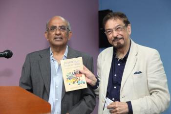 Dr. Mohamed Keshavjee (R) with Matthew Thomas (L)