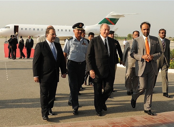 October 13, 2009: Interim Governor of Gilgit-Baltistan Qamar Zaman Kaira and The Aga Khan National Council President Iqbal Waljee receieve Prince Aga Khan on his arrival at the Benazir Bhutto International Airport on Tuesday (dated)