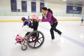 Olympic medallist Jamie Sale and Shakeel Gaidhar give kids a twirl