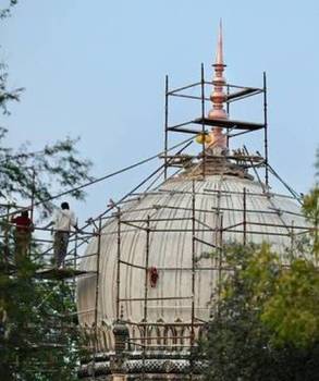 Finally, the finial gets fixed at Qutb Shahi tombs